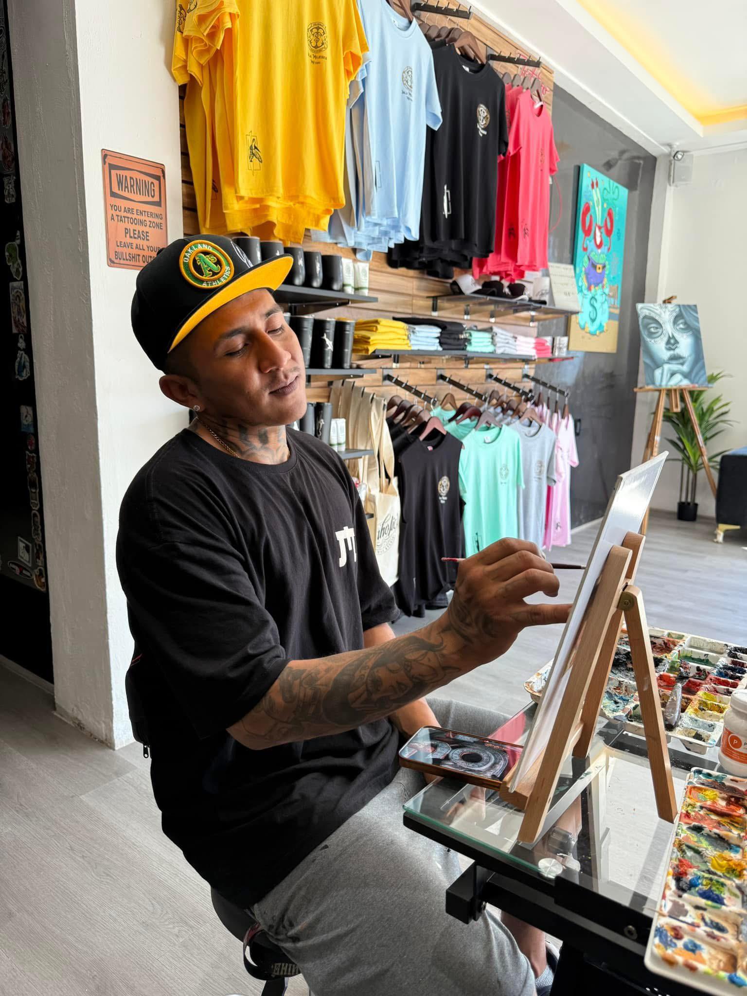 INKaholic artist painting in the studio