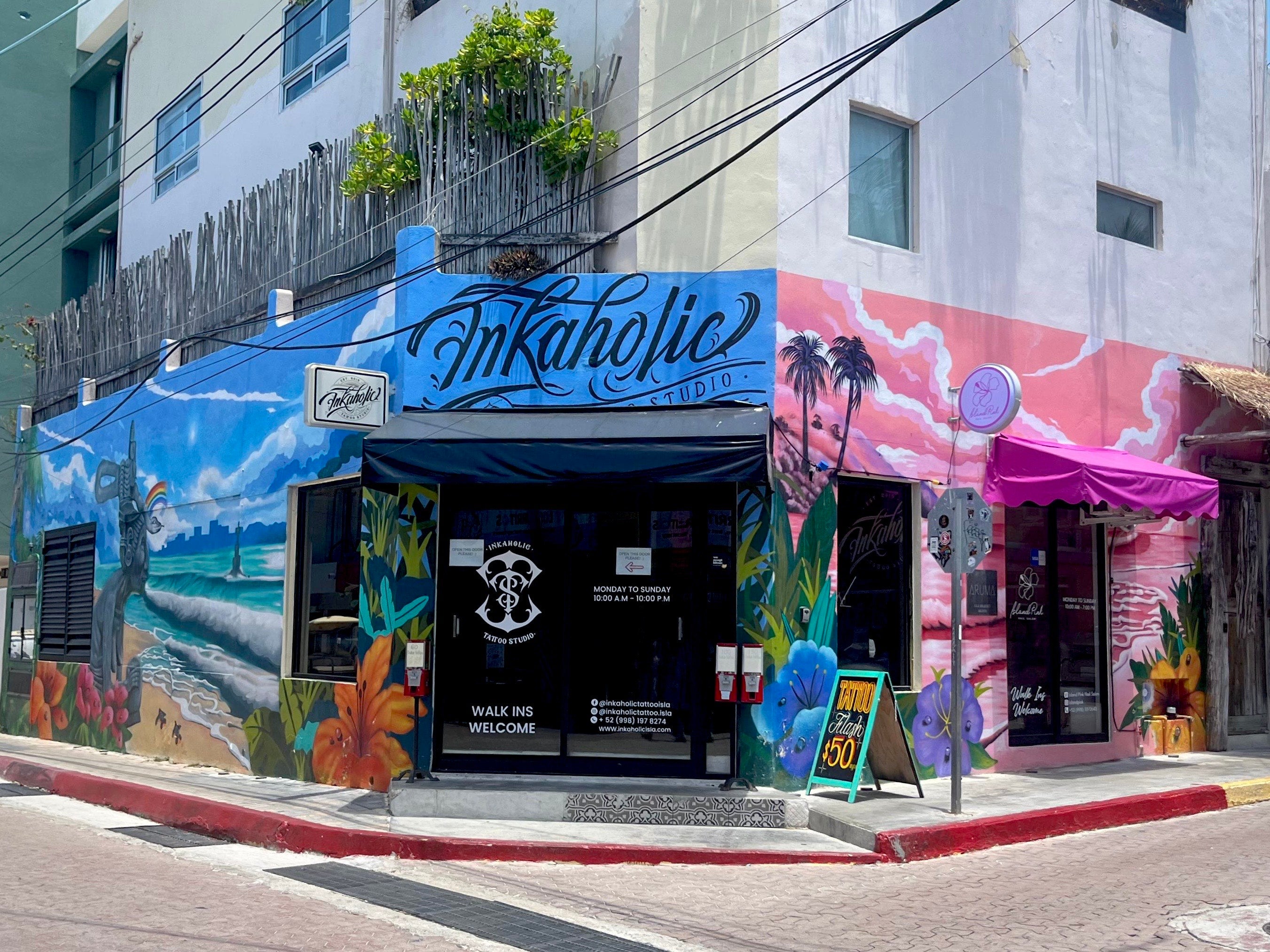 INKaholic Tattoo Isla storefront with its mural