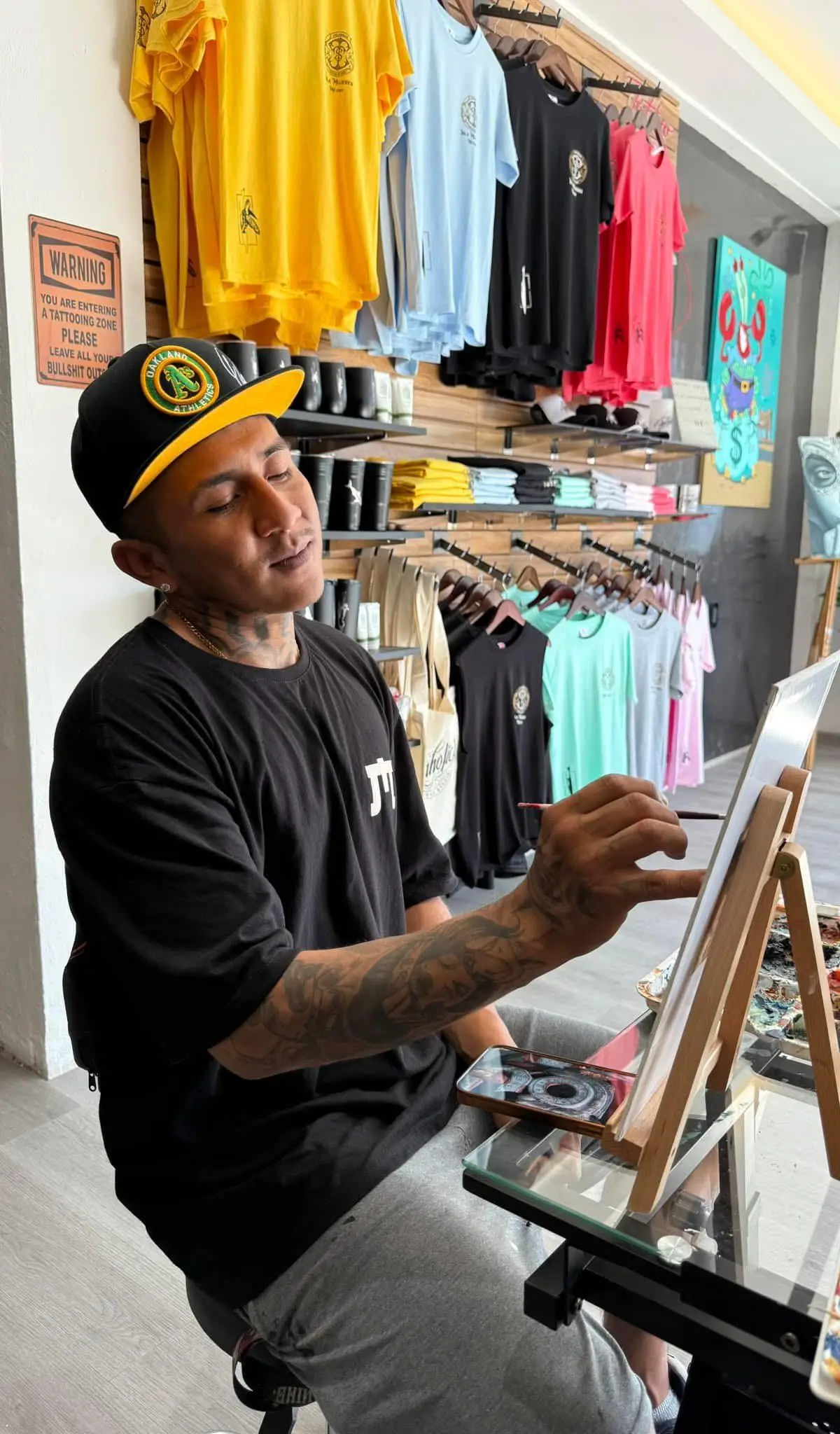 INKaholic artist painting in the studio