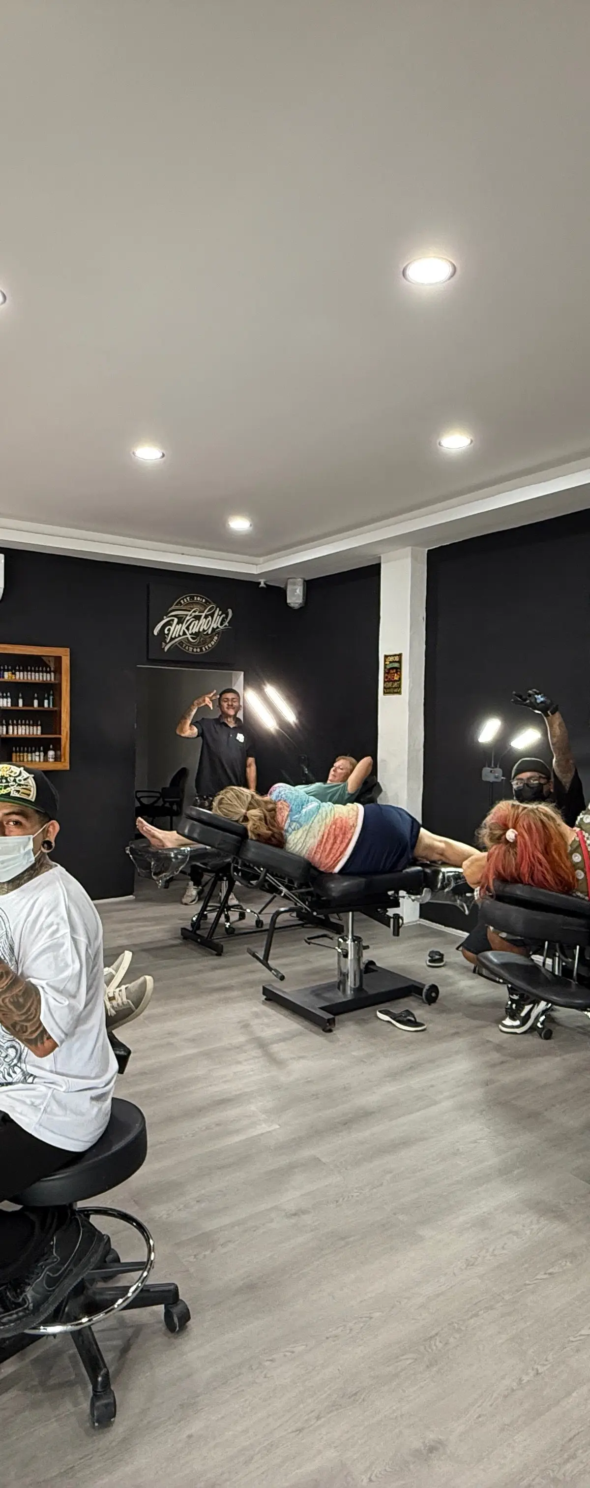 INKaholic tattoo room with its stations in use