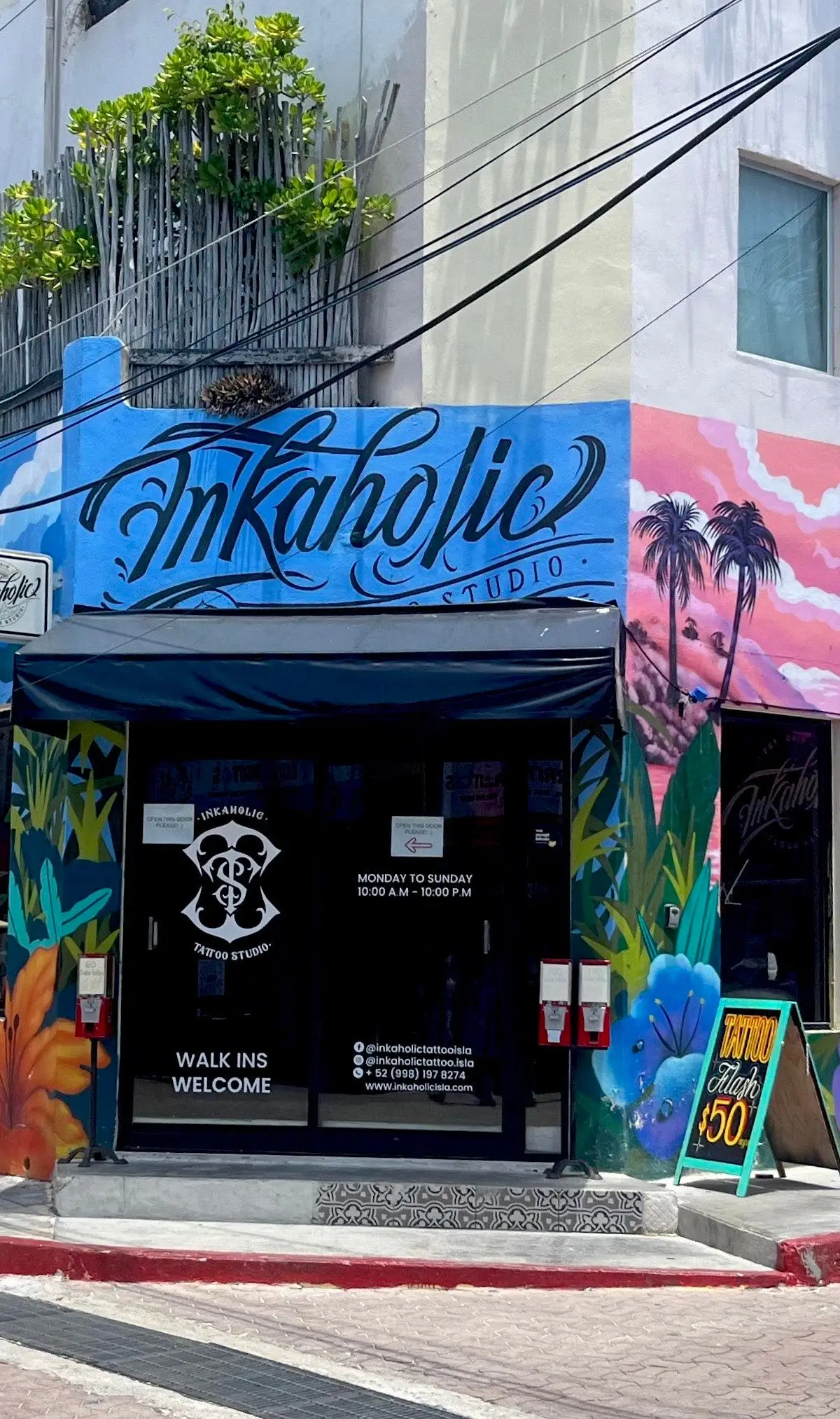 INKaholic Tattoo Isla storefront with its mural